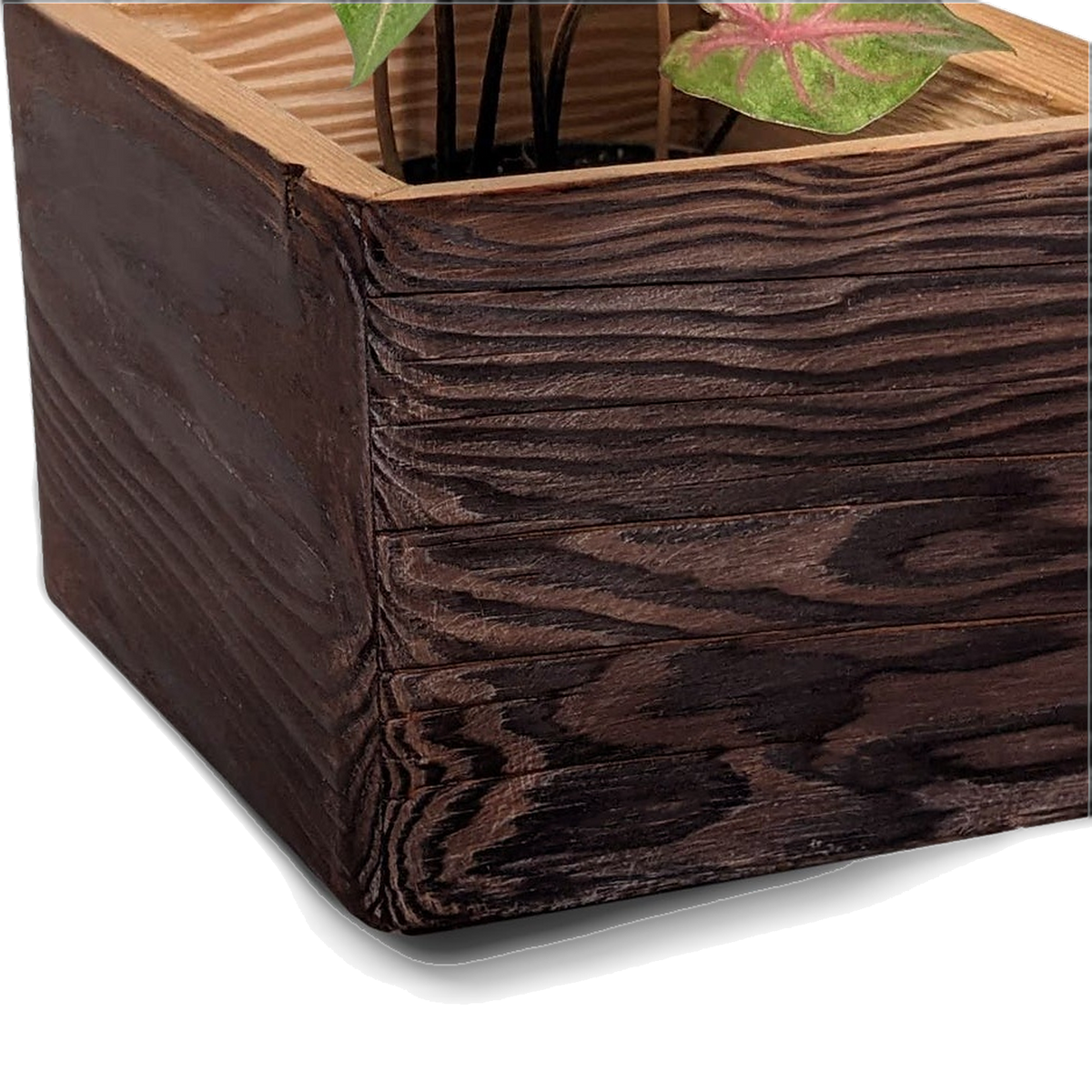 Torched brushed-brown reclaimed pine planter exterior with a natural lip (close-up detail)