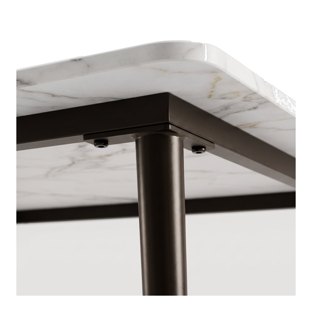 Steel under-frame with the leg bolted into its corner mounting plate (close-up detail)