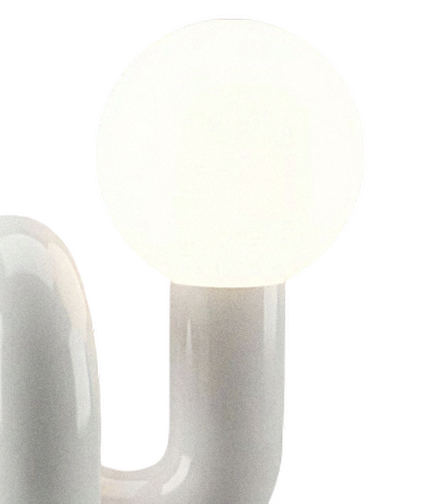 Frosted glass globe seated on the ceramic column, transparent close-up