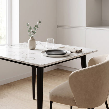Square sintered stone dining table set for two in a bright kitchen dining nook (room)