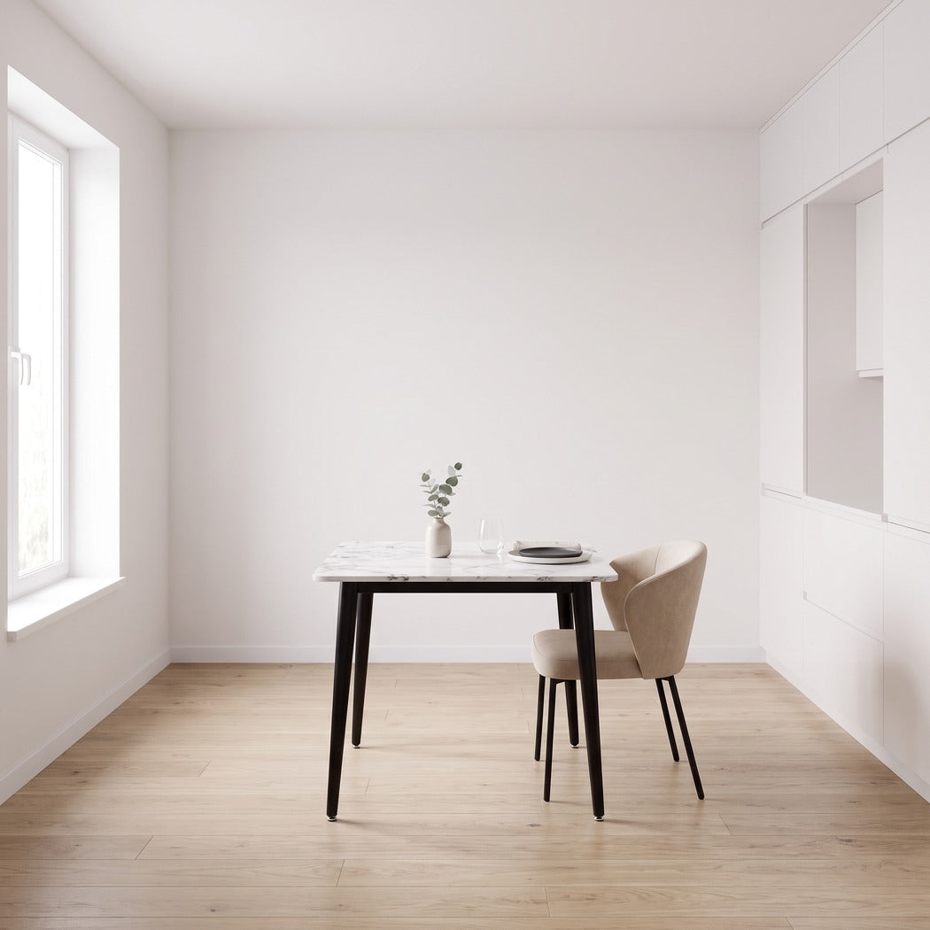 Square sintered stone dining table in a bright kitchen dining nook, wide view (room)