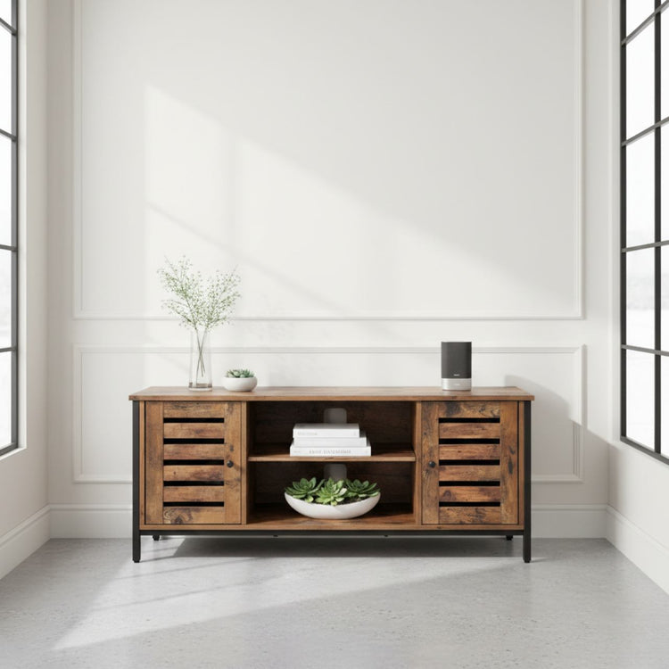 Modern mid-century industrial TV stand with louvered doors, wood and iron, open shelves with books and plants.