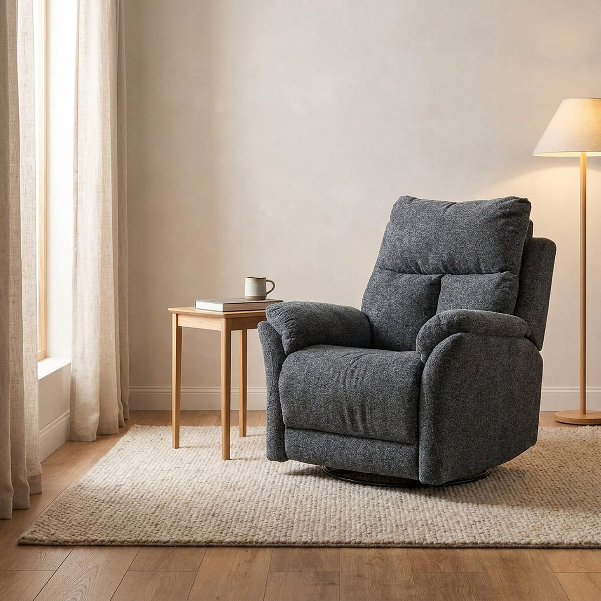 Gray swivel recliner beside an oak side table in a bright living room