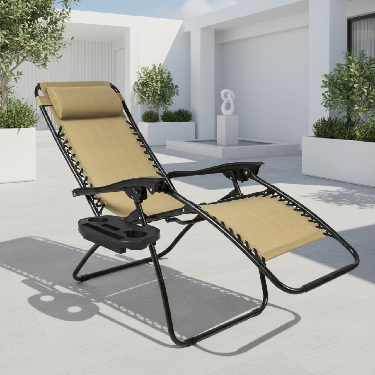 Portable tan and black Zero Gravity recliner with a weightless suspension system; stylish and functional folding chair for backyard relaxation.