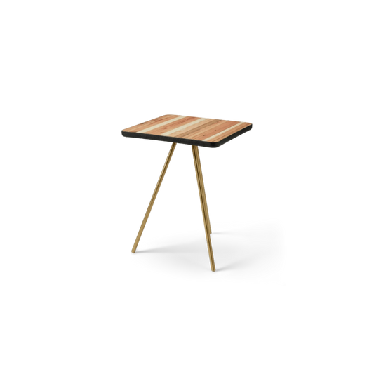 Tripod side table with a torched reclaimed-wood top and brass legs, angled view