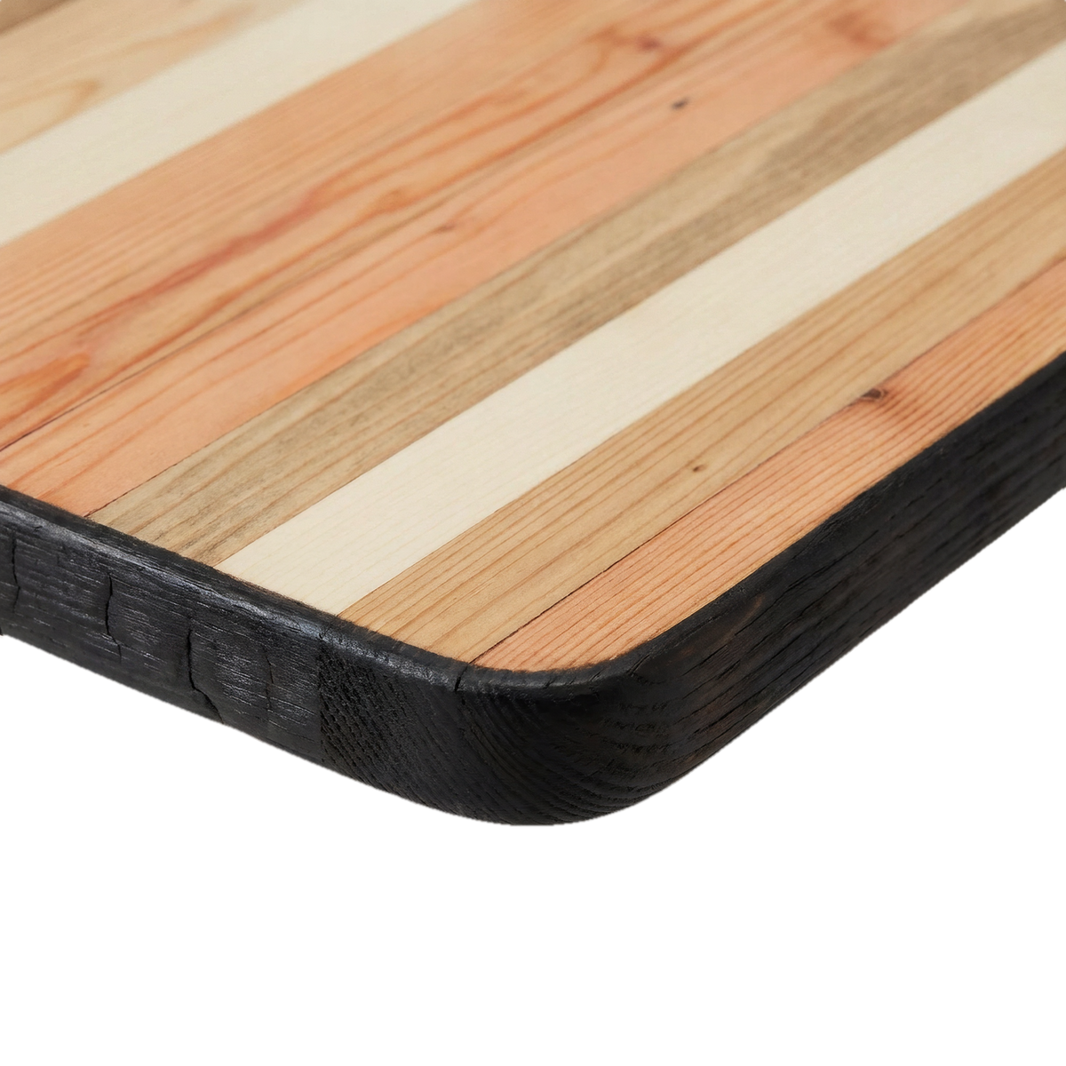 Close-up of the torched black edge and pieced reclaimed-wood top