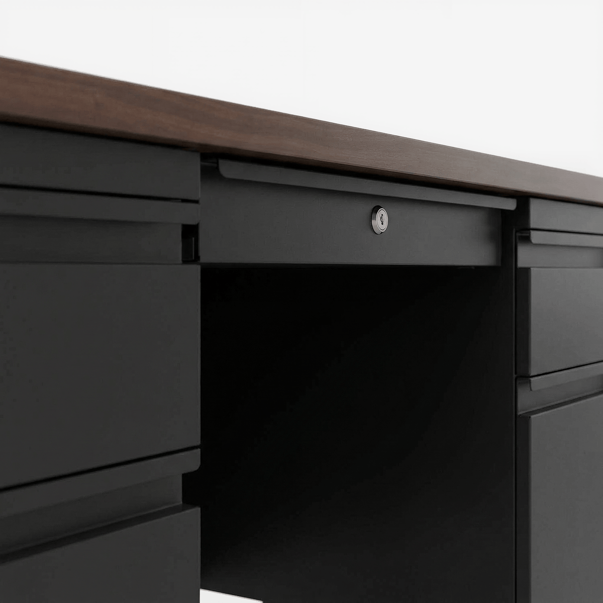 Teacher's desk locking center drawer and pedestal drawers on a light grey ground (close-up detail)