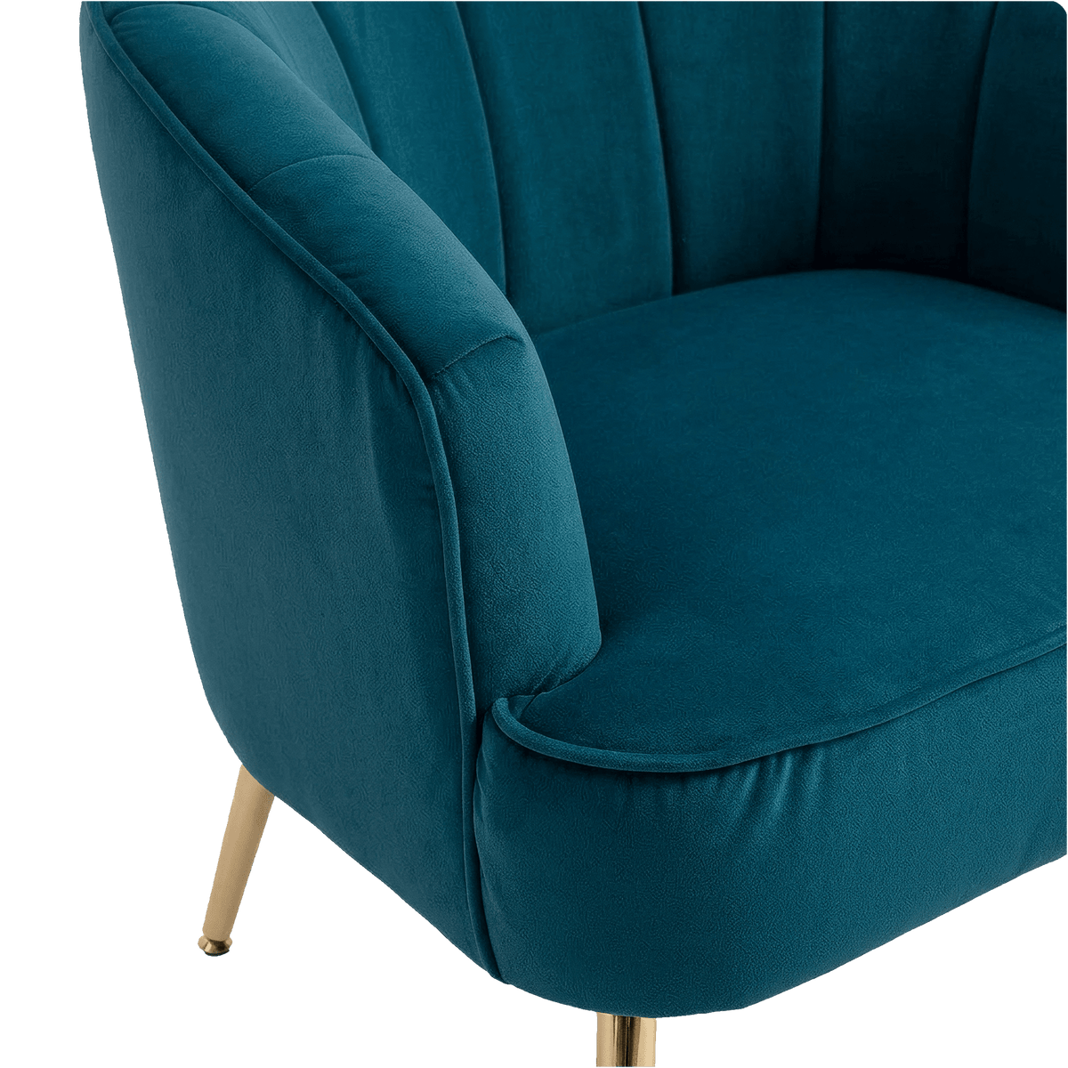 Rounded piped teal velvet arm of the barrel chair (close-up detail)
