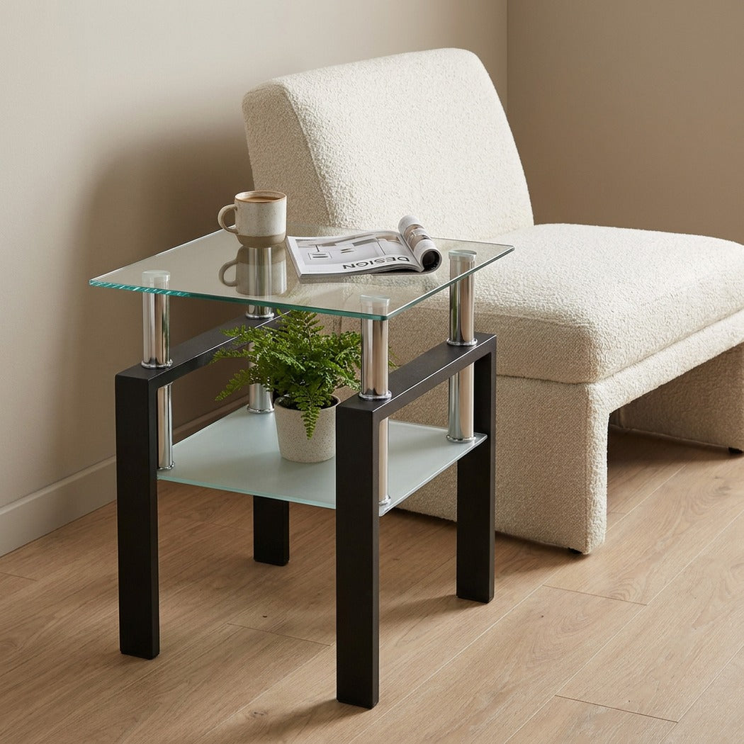 Square tempered glass tea table beside a living room chair