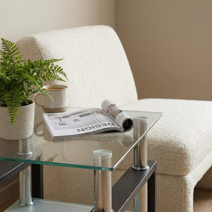 Square tempered glass tea table styled with coffee and a plant