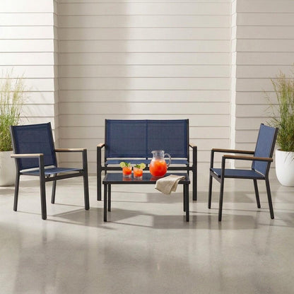 Textilene patio conversation set with glass-top table on a covered patio