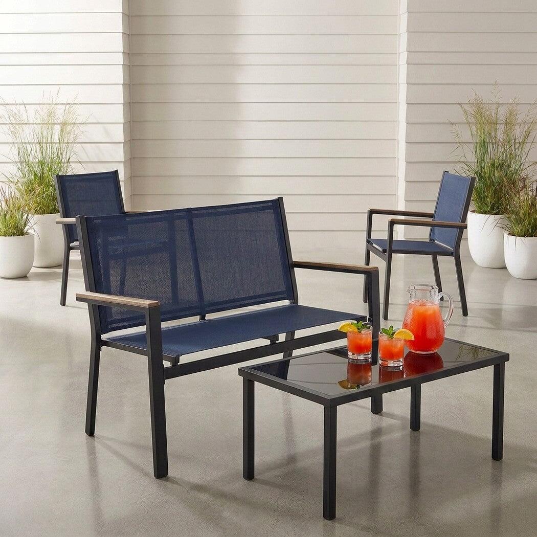 Textilene patio conversation set with glass-top table, rotated view on a covered patio