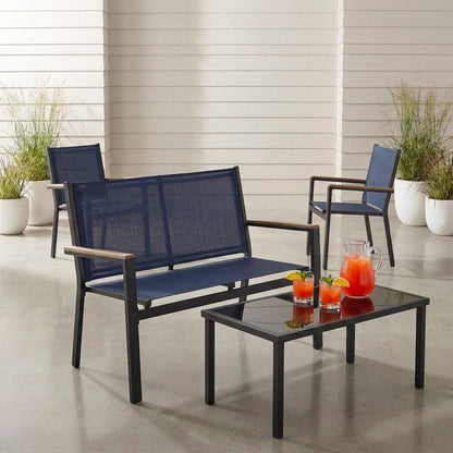 Textilene patio conversation set with glass-top table, rotated view on a covered patio