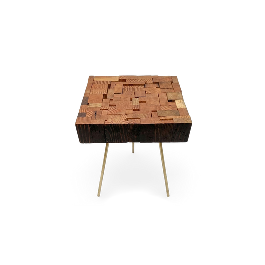 Reclaimed wood side table with charred sides and brass legs, angled view (plain studio)