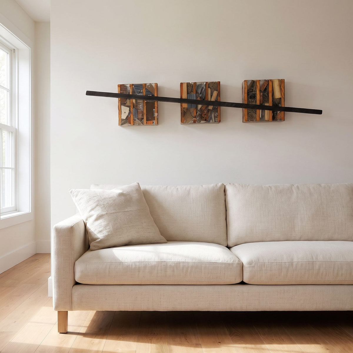 Three panel wood wall art above a sofa in a living room, closer view