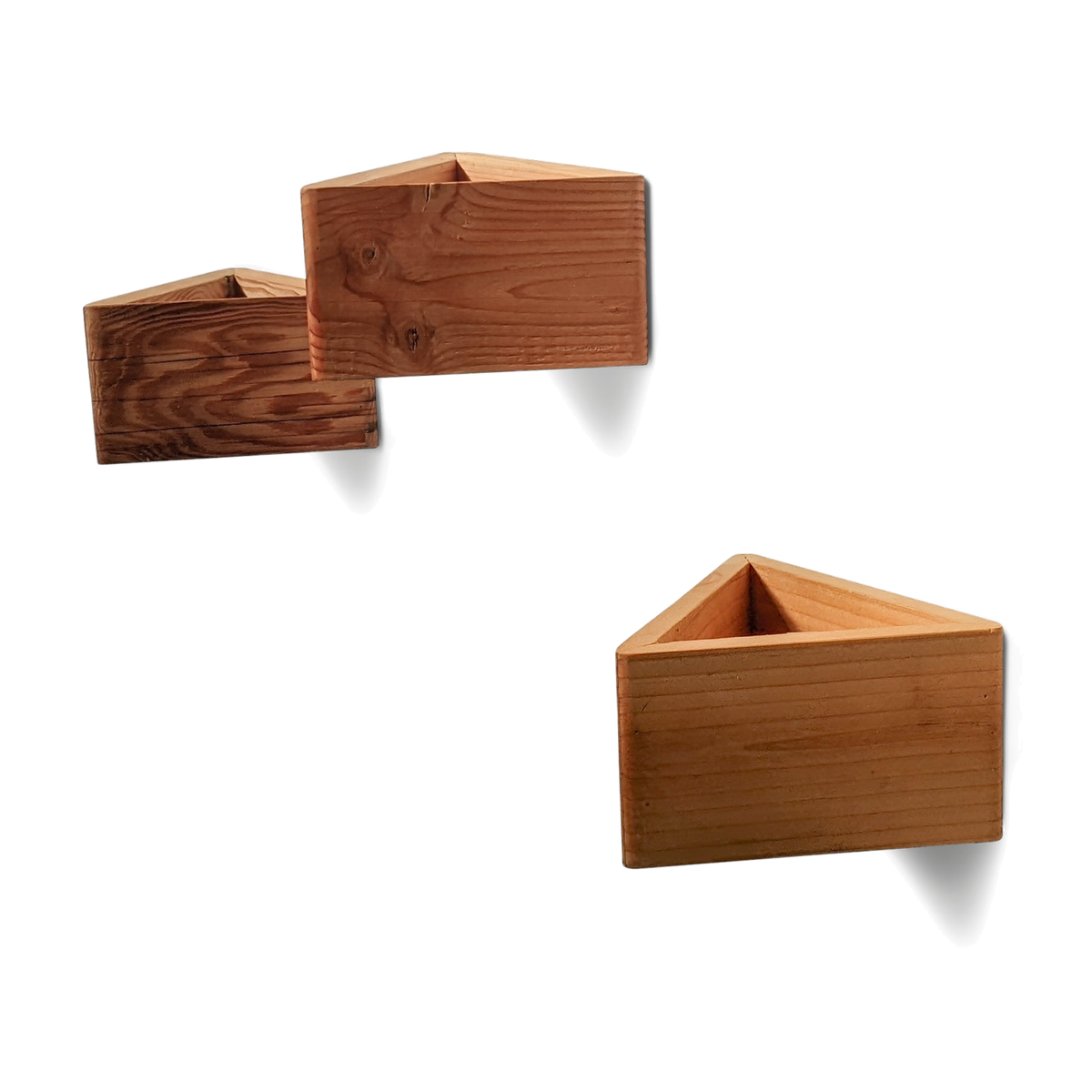 Three natural reclaimed wood triangle wall planters mounted in a staggered group
