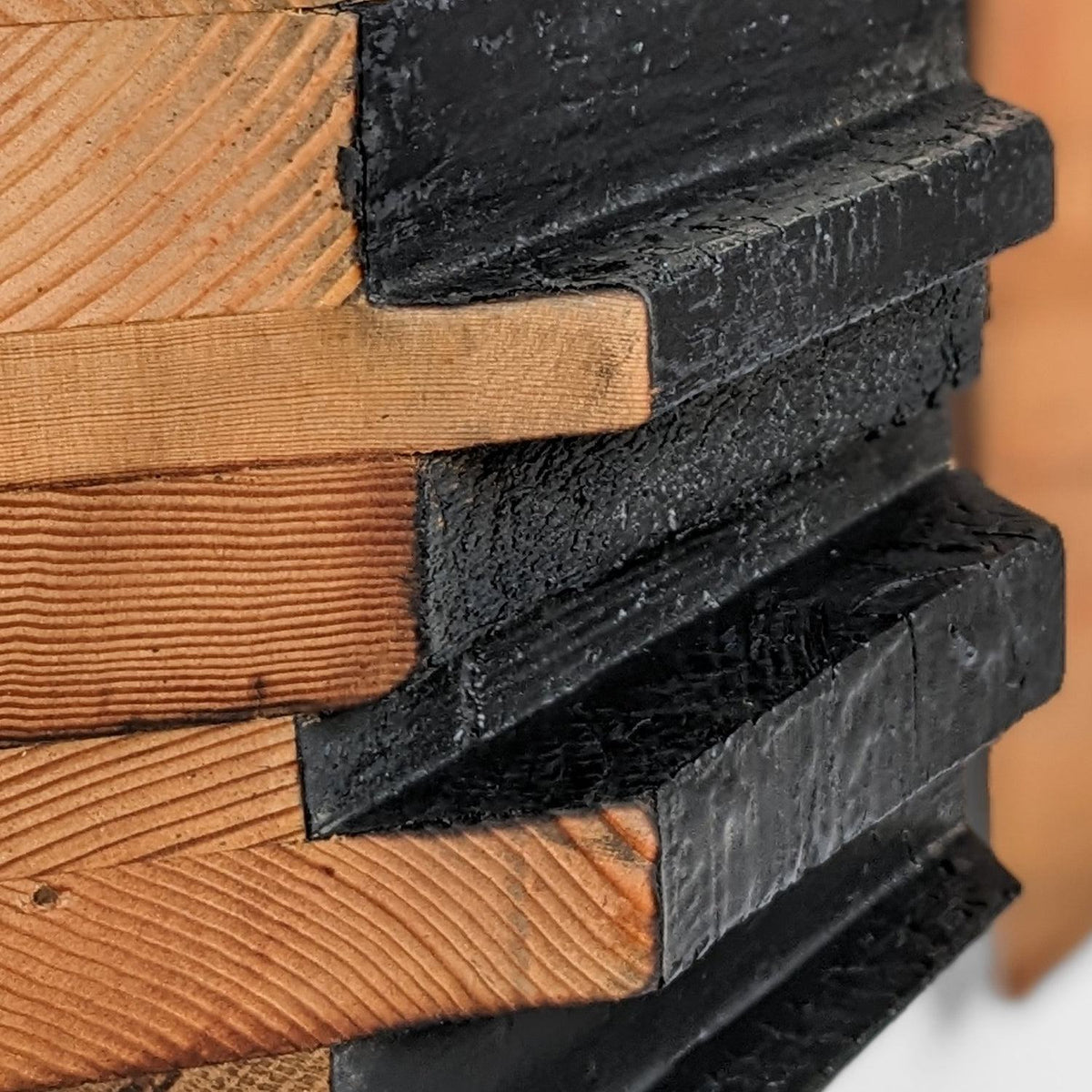 Close-up of the charred, epoxy-hardened stepped black centre panel
