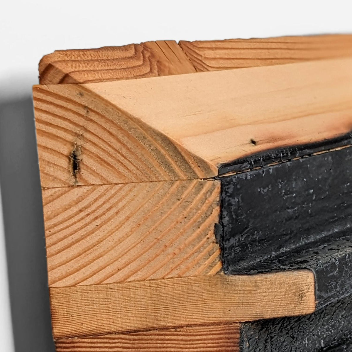 Close-up of the oiled fir outer frame with bevelled edge