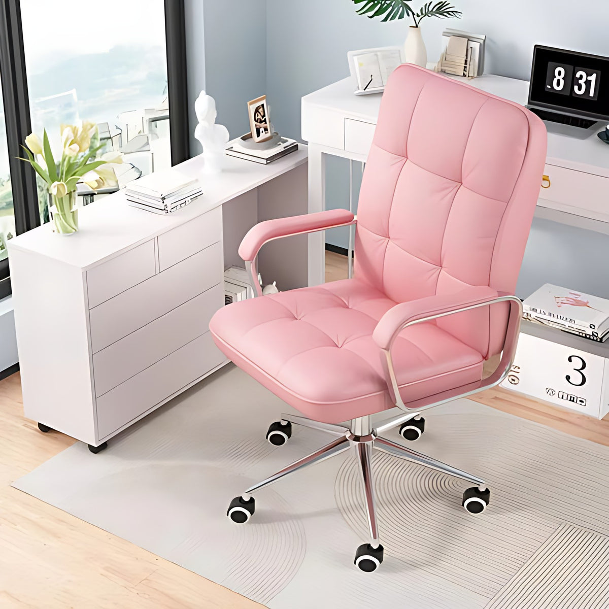 Pink leather swivel ergonomic office chair with tufted back, chrome arms, five-star base in a home office.