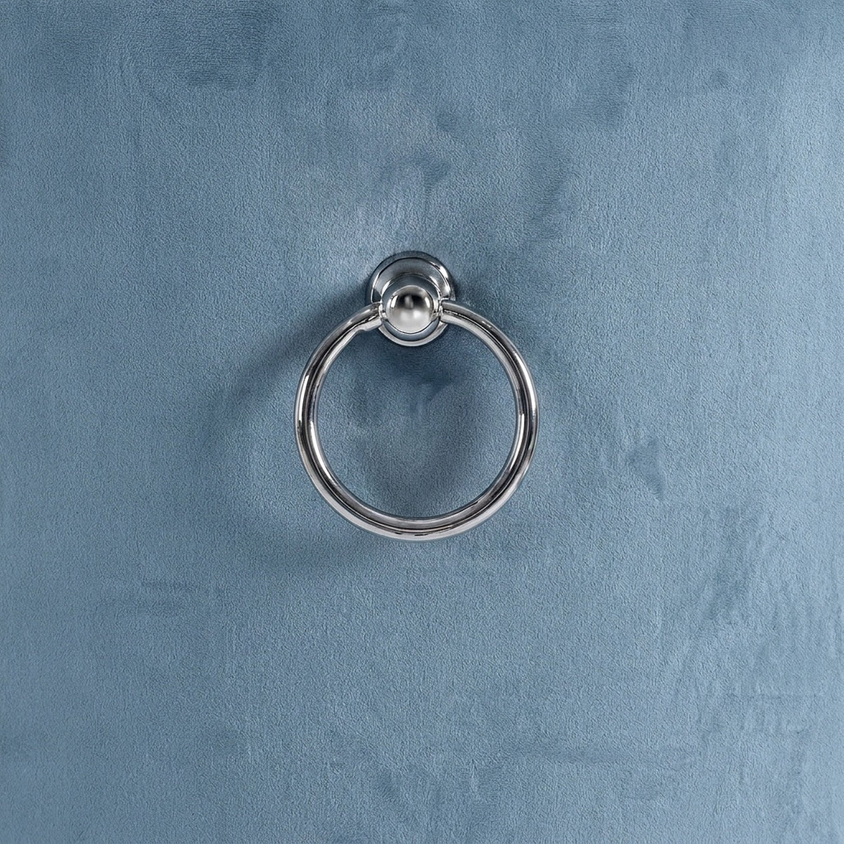 Polished chrome ring pull on the velvet back (close-up detail)