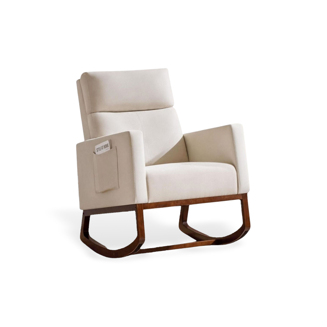 Wood-base rocking chair with side storage pocket, shown in a cream fabric finish against a #f3f3f3 studio backdrop.