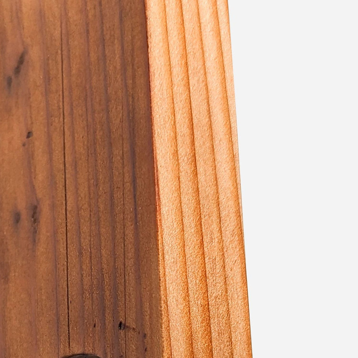 Edge grain and oiled finish of a reclaimed fir board (close-up detail)