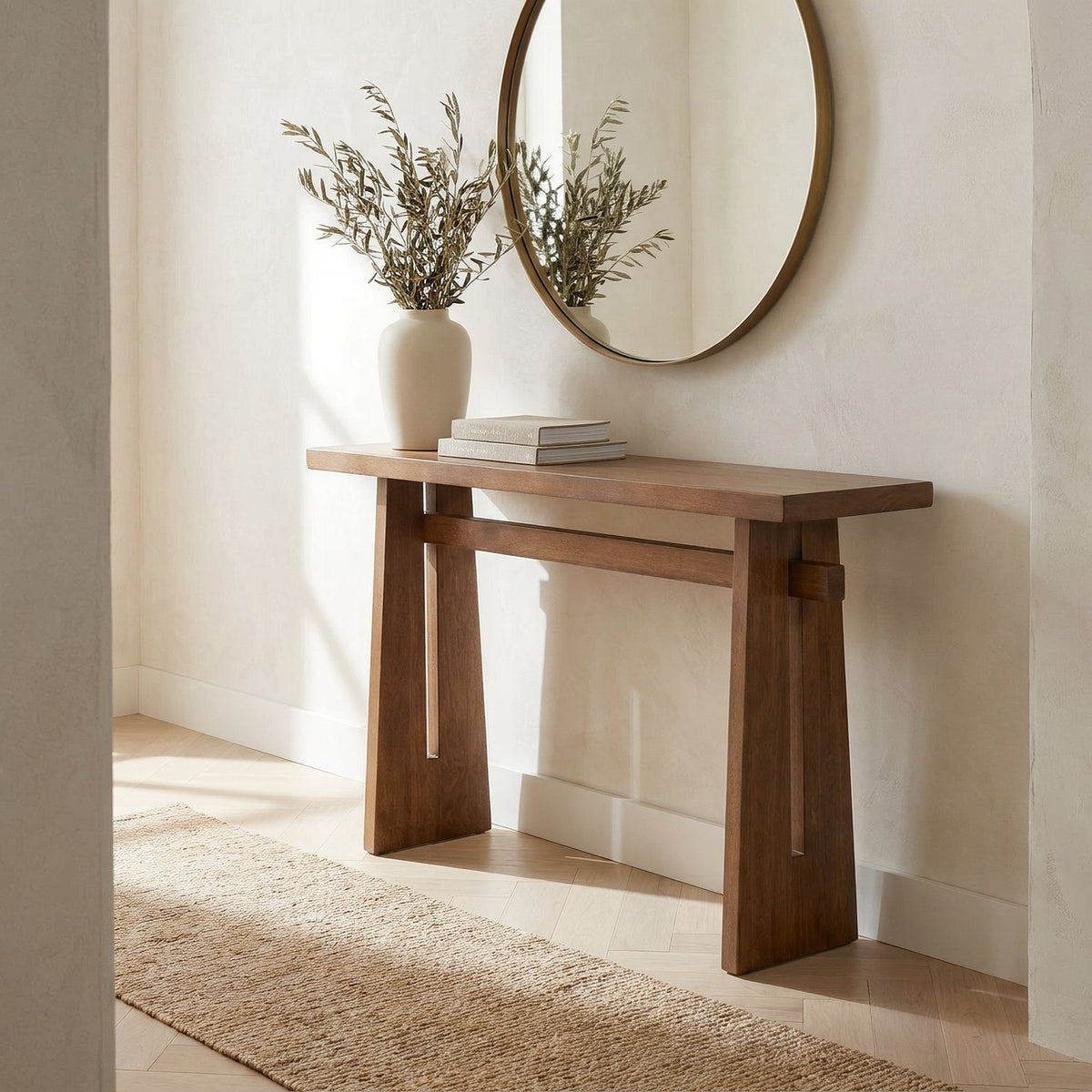 Console in an entry hall, three-quarter view beside a jute runner