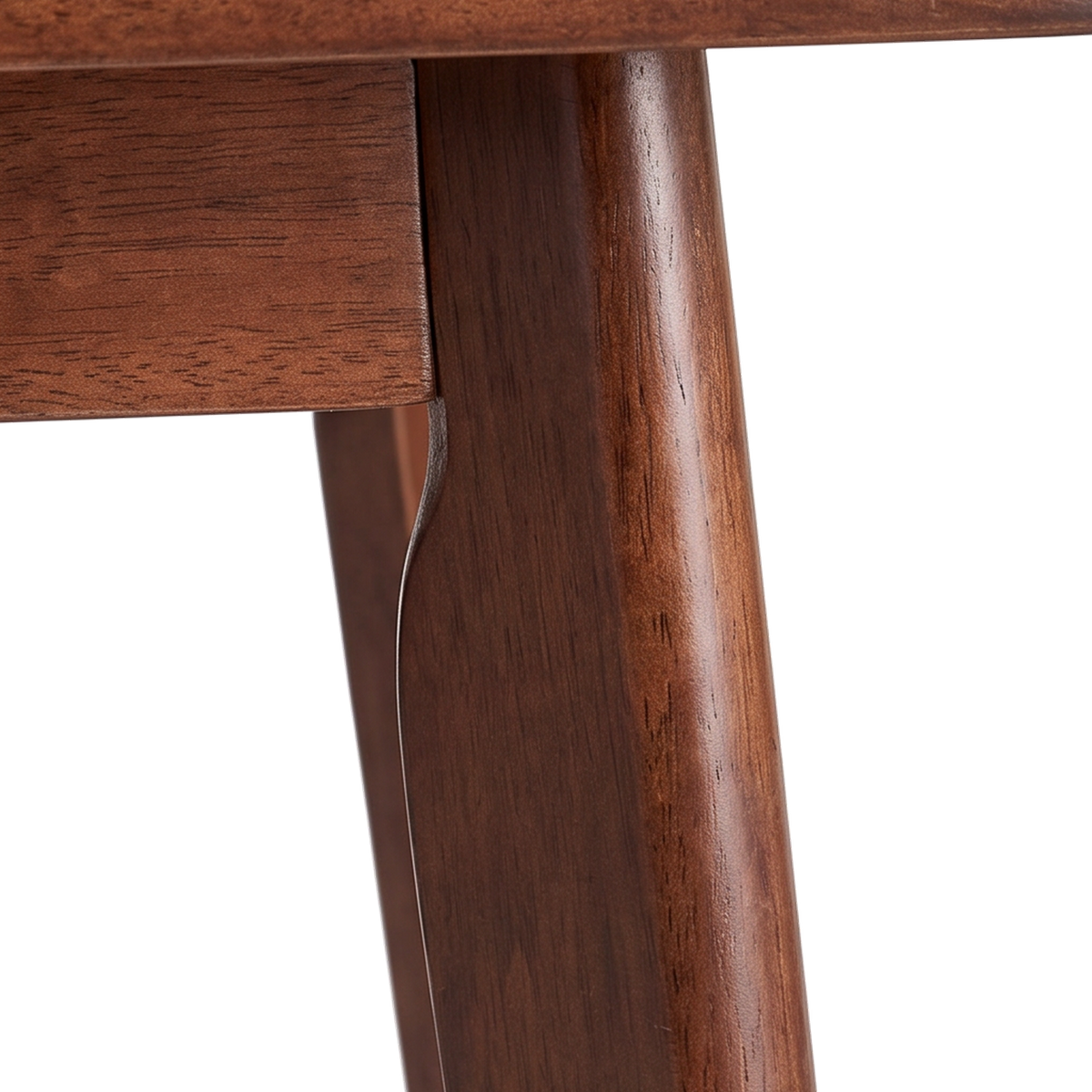 Close-up of the curved notch where the tapered leg meets the apron (close-up detail)