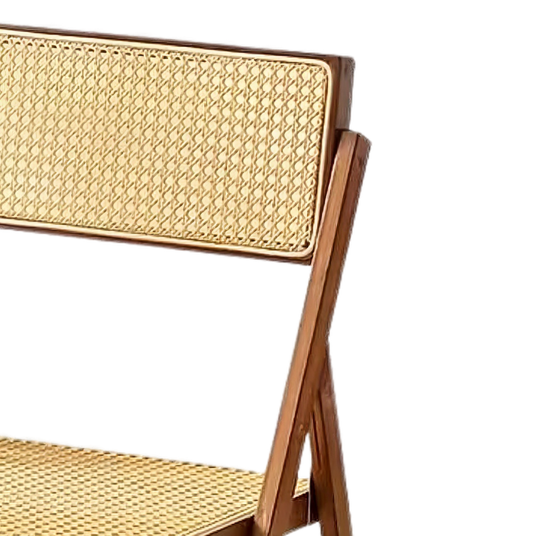 Hand-woven cane backrest in the walnut-finish bamboo frame (close-up detail)