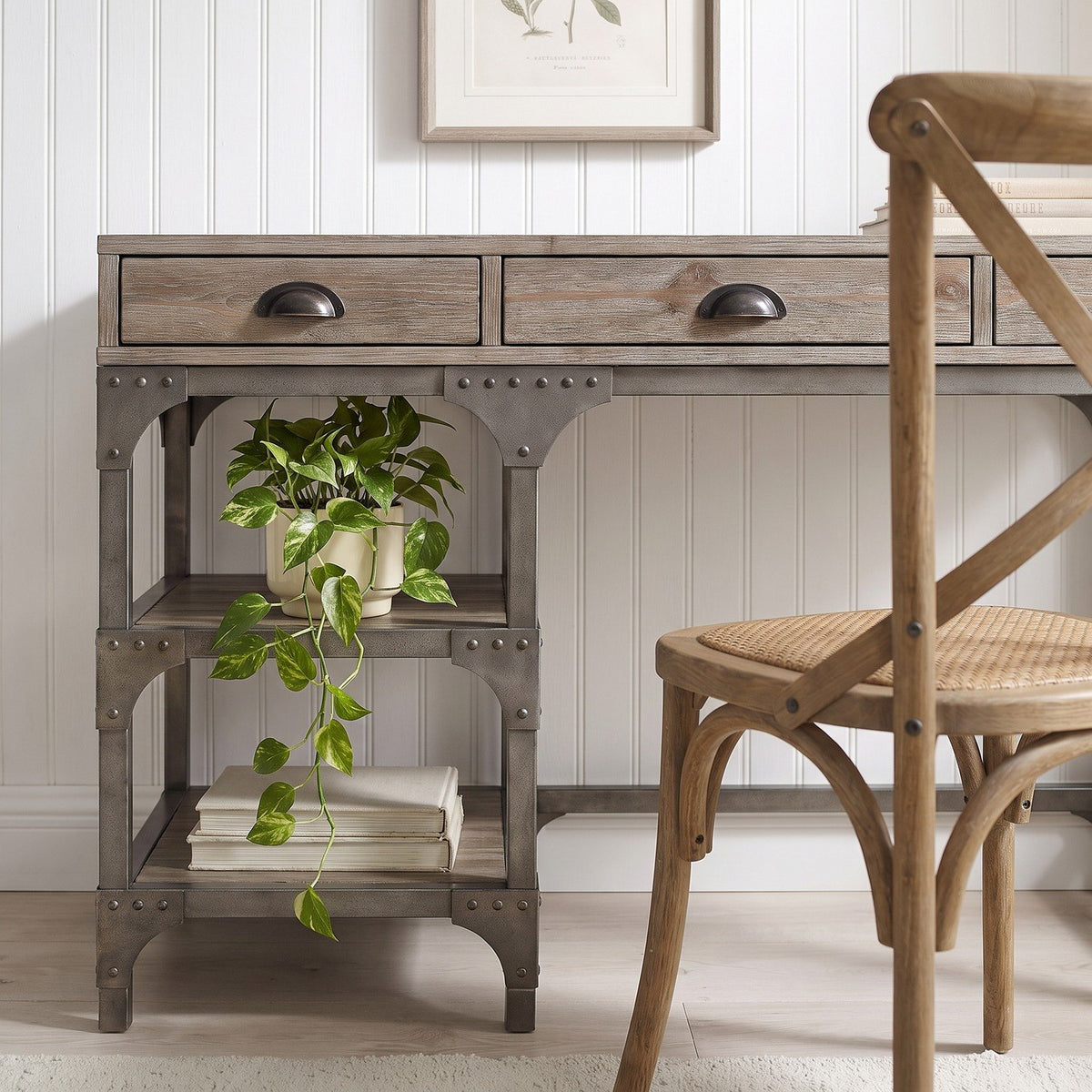 Closer low-angle view of the oak desk in the same study