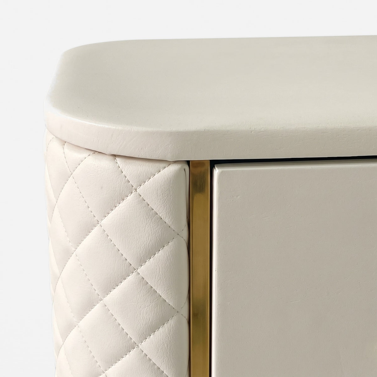 Rounded top corner with gold front strip and quilted panel, close up