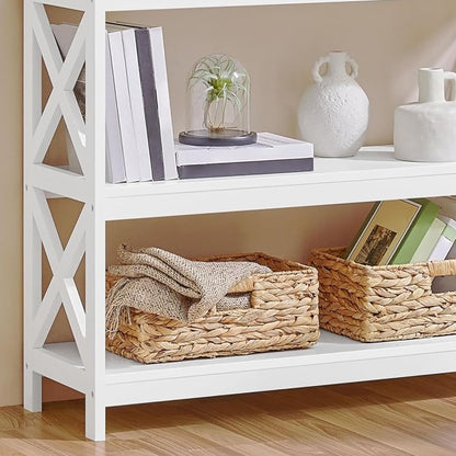 Close-up of the lower shelf, legs and a woven basket of the console table in a styled hallway