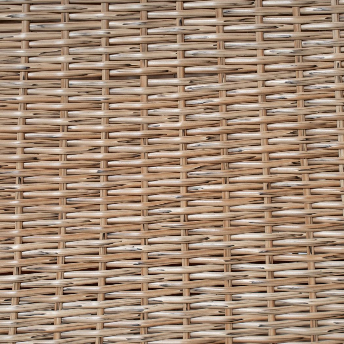 Close-up of the gray handwoven wicker of the table legs