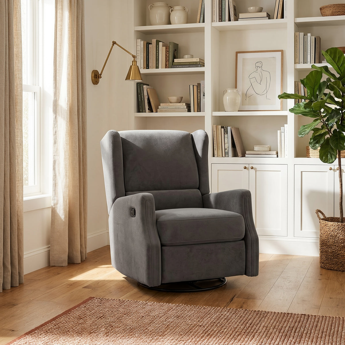 Dark gray wingback recliner beside built-in bookshelves, a brass wall lamp and a fiddle-leaf fig in a bright living room
