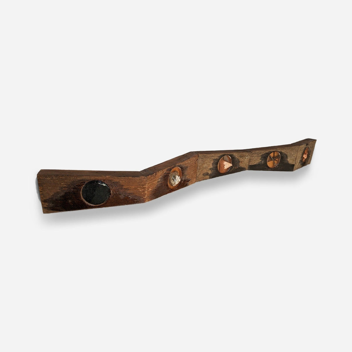Entryway wall sculpture in wood and resin, angled view