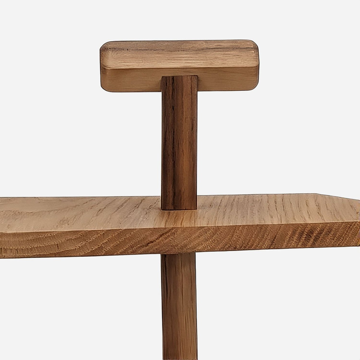 Flat wooden T handle on top of the centre post (close-up detail)