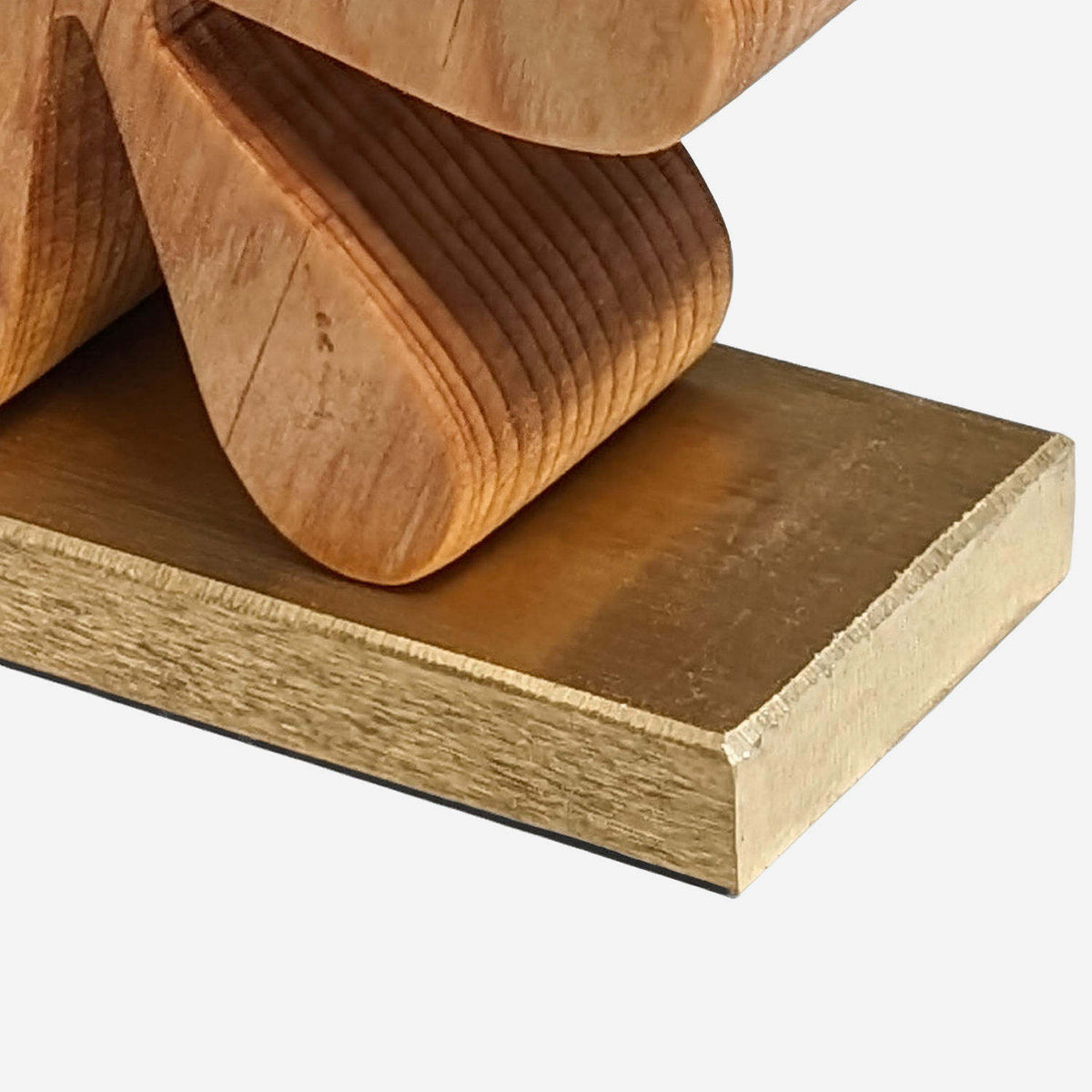 Brushed brass base plate corner of wooden starburst bookends