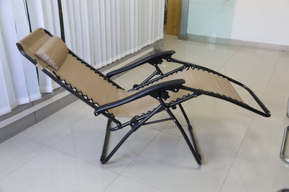 Zero Gravity Lounge Chair with Dual Side Tray in tan fabric, reclined for neck and back relief.