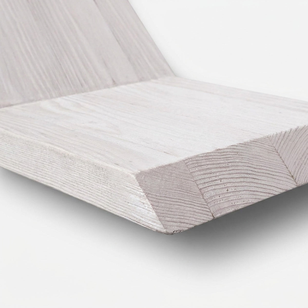 White-stained shelf tray edge with the wood grain showing through the matte finish (close-up detail)